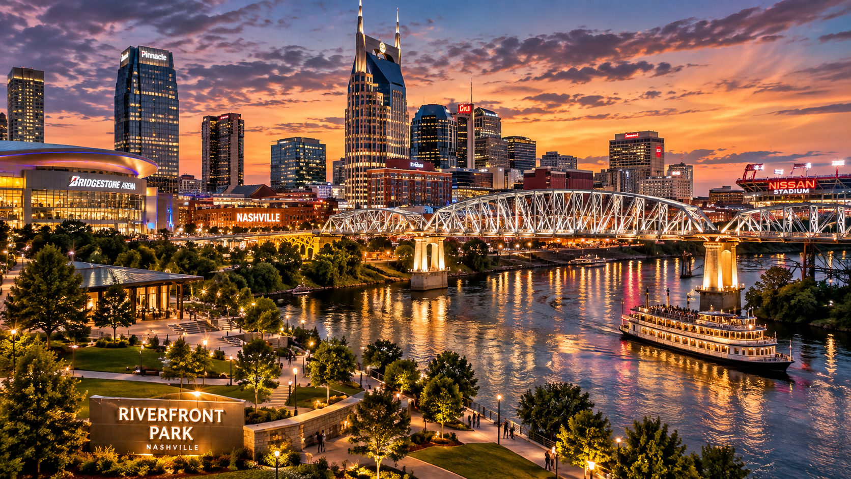 Nashville Riverfront at sunset with the Cumberland River, skyline, bridge, and riverboat